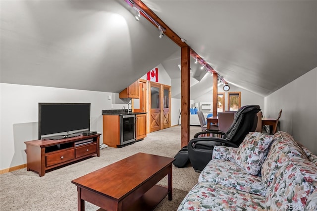 living room featuring wine cooler, track lighting, light carpet, and lofted ceiling