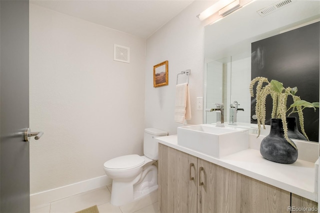 bathroom with vanity, tile patterned floors, toilet, and visible vents