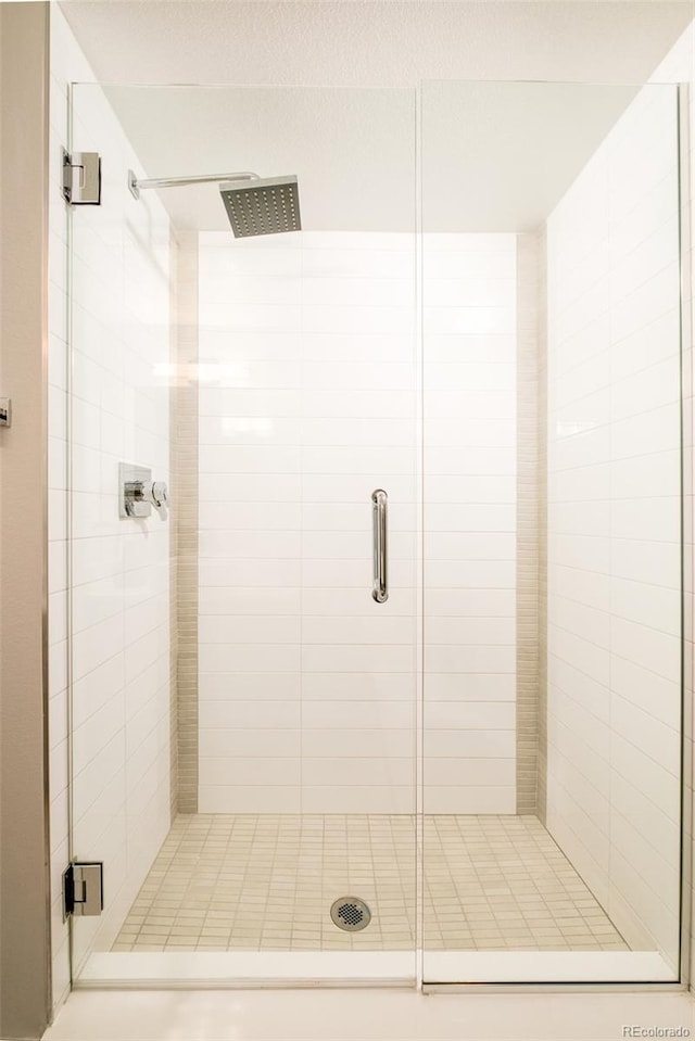 bathroom featuring a stall shower