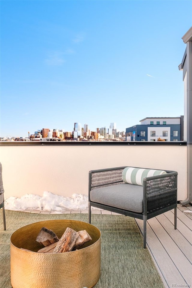 view of patio / terrace with a balcony and a city view