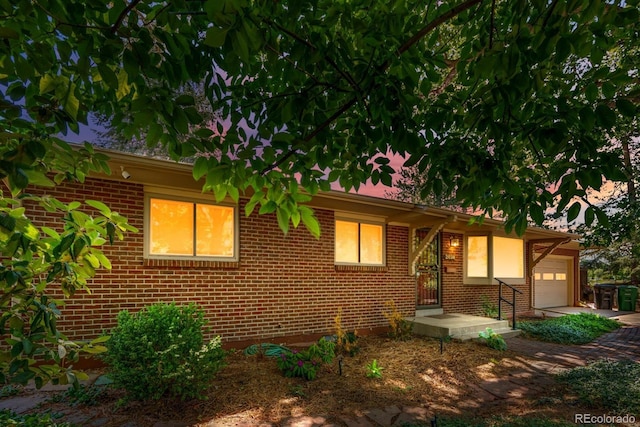 2698 S Niagara St, Denver, CO 80224 - ranch-style house with a garage and brick siding