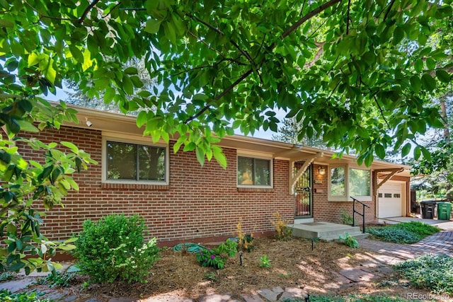 2698 S Niagara St, Denver, CO 80224 - ranch-style house with an attached garage and brick siding
