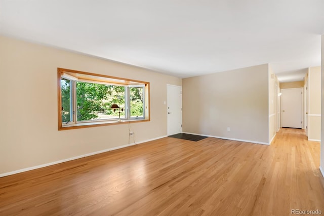 2698 S Niagara St, Denver, CO 80224 - empty room featuring light wood-type flooring and baseboards