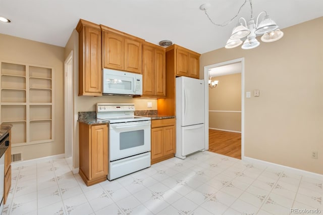 2698 S Niagara St, Denver, CO 80224 - kitchen featuring white appliances, a chandelier, light flooring, and brown cabinets