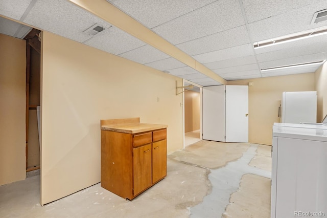 2698 S Niagara St, Denver, CO 80224 - finished below grade area with washer / dryer, a drop ceiling, and freestanding refrigerator