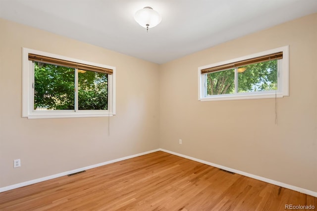 2698 S Niagara St, Denver, CO 80224 - empty room with baseboards and light wood finished floors