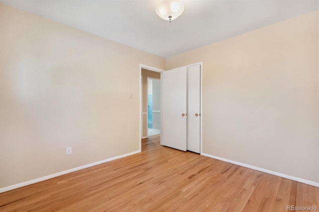 2698 S Niagara St, Denver, CO 80224 - empty room with baseboards and light wood-style flooring