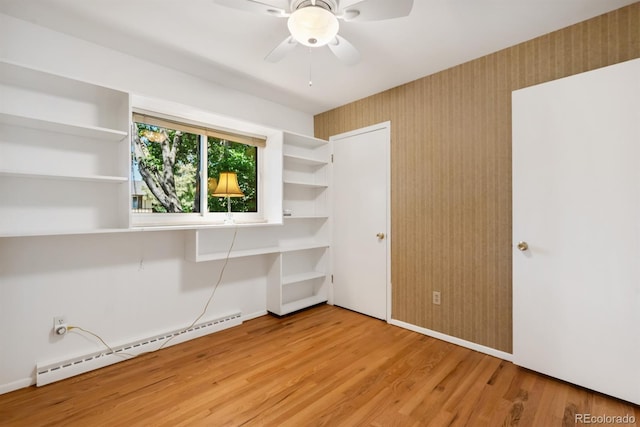 2698 S Niagara St, Denver, CO 80224 - unfurnished bedroom featuring a baseboard radiator, light wood-style flooring, and ceiling fan