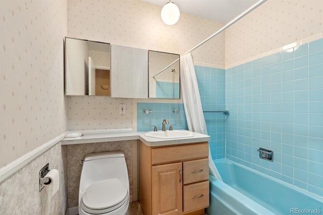 2698 S Niagara St, Denver, CO 80224 - bathroom featuring wallpapered walls, vanity, shower / bathtub combination with curtain, a wainscoted wall, and tile walls