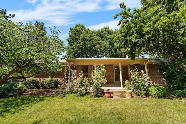 2698 S Niagara St, Denver, CO 80224 - ranch-style home featuring brick siding and a front lawn