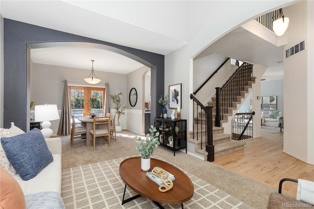 living room featuring light hardwood / wood-style flooring and french doors