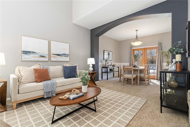 carpeted living room with french doors