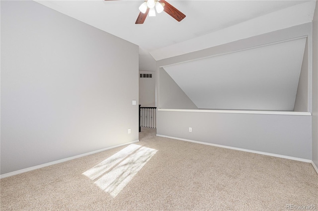 bonus room featuring lofted ceiling, ceiling fan, and carpet flooring