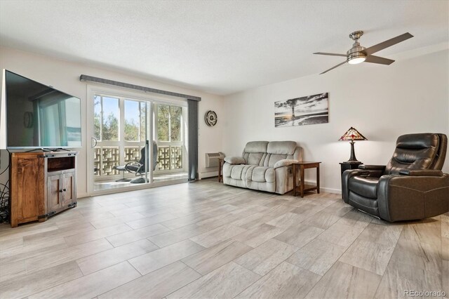 795 S Alton Way Unit 4C, Denver, CO 80247 - living room featuring ceiling fan and baseboards