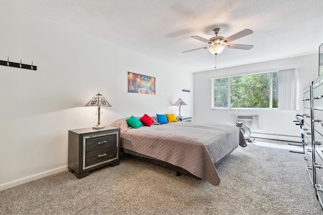 795 S Alton Way Unit 4C, Denver, CO 80247 - bedroom with a baseboard radiator, light carpet, baseboards, a textured ceiling, and a ceiling fan