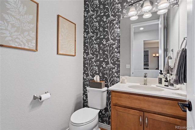 bathroom with vanity and toilet