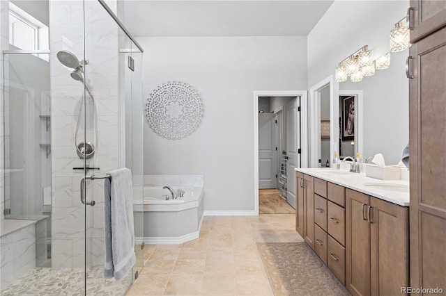 bathroom with independent shower and bath, vanity, and tile patterned floors