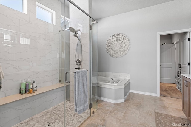 bathroom with separate shower and tub