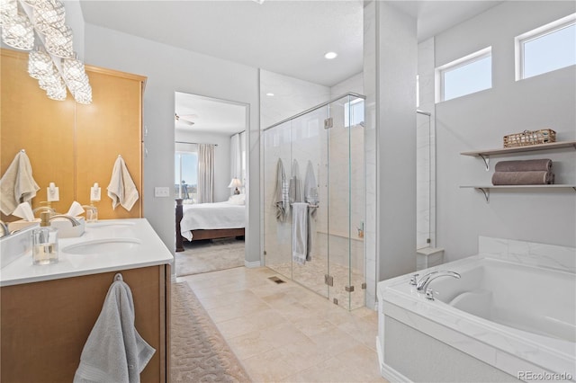 bathroom featuring vanity and separate shower and tub