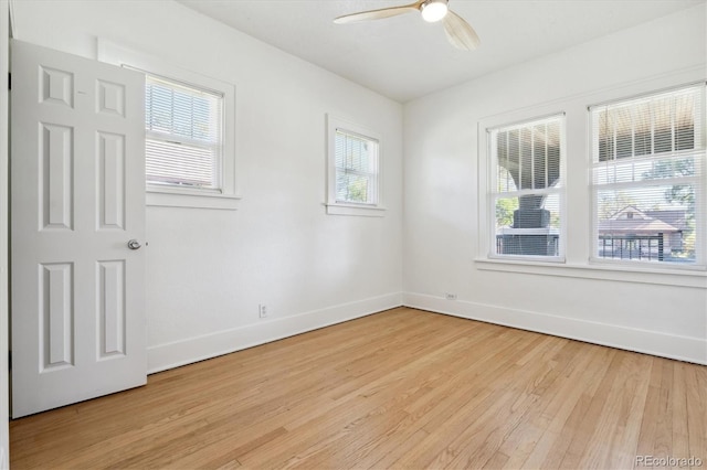 unfurnished room with light wood-type flooring, ceiling fan, and a healthy amount of sunlight