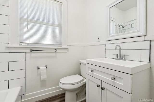 full bathroom featuring separate shower and tub, hardwood / wood-style flooring, vanity, and toilet