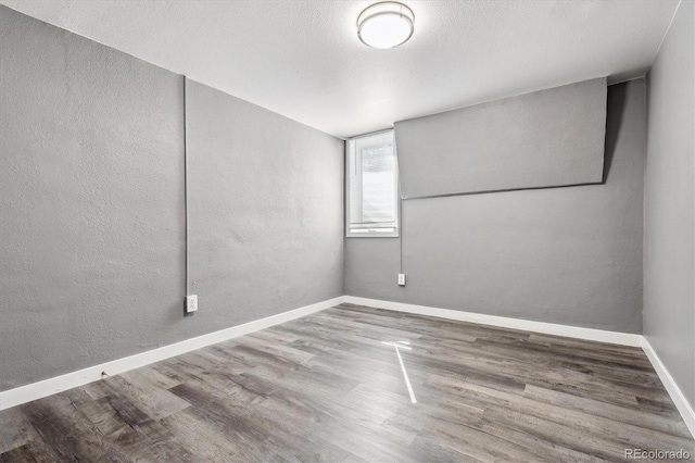 spare room featuring hardwood / wood-style floors