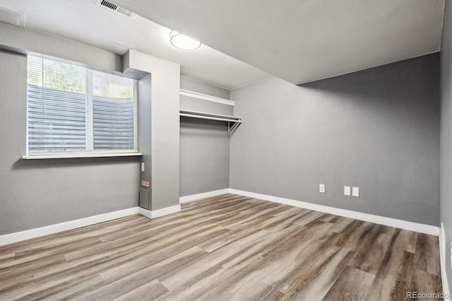 walk in closet featuring hardwood / wood-style flooring