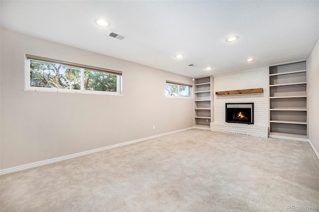 unfurnished living room featuring carpet, visible vents, baseboards, and recessed lighting