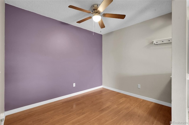 14214 E 1st Dr Unit B08, Aurora, CO 80011 - unfurnished room featuring ceiling fan, wood finished floors, and a textured ceiling