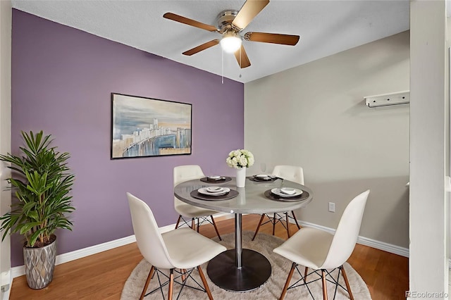14214 E 1st Dr Unit B08, Aurora, CO 80011 - dining space with a ceiling fan and wood finished floors