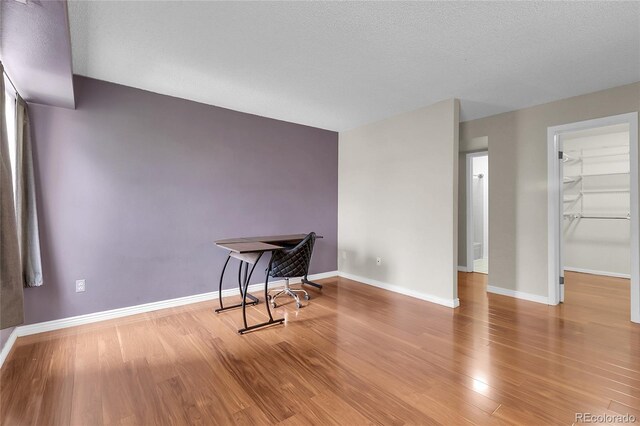 14214 E 1st Dr Unit B08, Aurora, CO 80011 - unfurnished dining area featuring wood finished floors