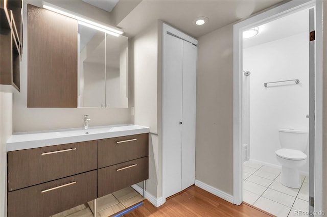 14214 E 1st Dr Unit B08, Aurora, CO 80011 - bathroom with vanity and wood finished floors