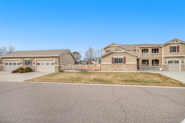 view of front of home featuring a front yard and a garage