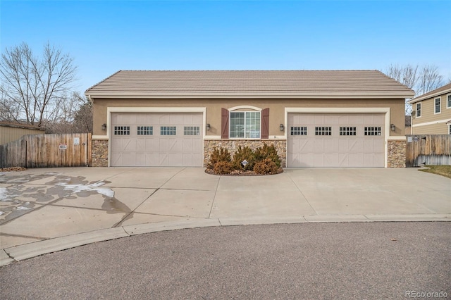 ranch-style home featuring a garage