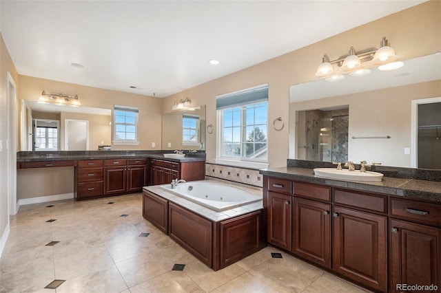 bathroom with separate shower and tub, tile patterned floors, and vanity