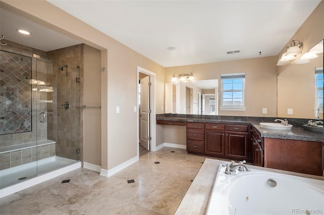 bathroom featuring vanity and shower with separate bathtub