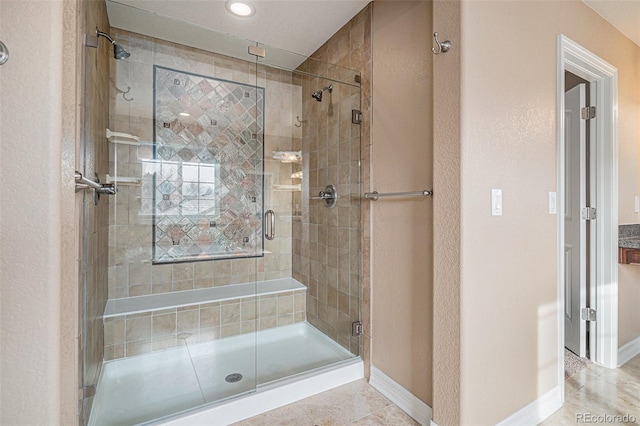 bathroom featuring tile patterned flooring and an enclosed shower