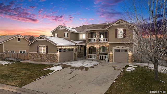 view of front of home featuring covered porch, a yard, and a balcony