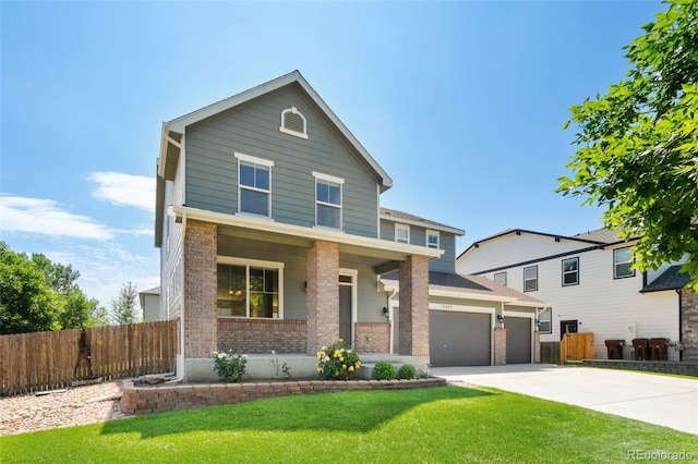 5894 Graphite St, Timnath, CO 80547 - traditional-style home with brick siding, concrete driveway, and a porch