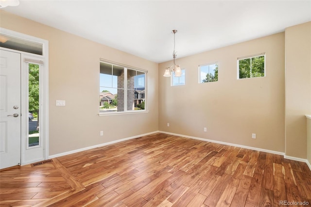 5894 Graphite St, Timnath, CO 80547 - entryway featuring a chandelier and light wood-style floors