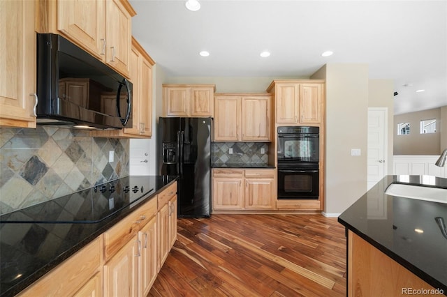 5894 Graphite St, Timnath, CO 80547 - kitchen with black appliances, light brown cabinets, dark wood-type flooring, decorative backsplash, and recessed lighting