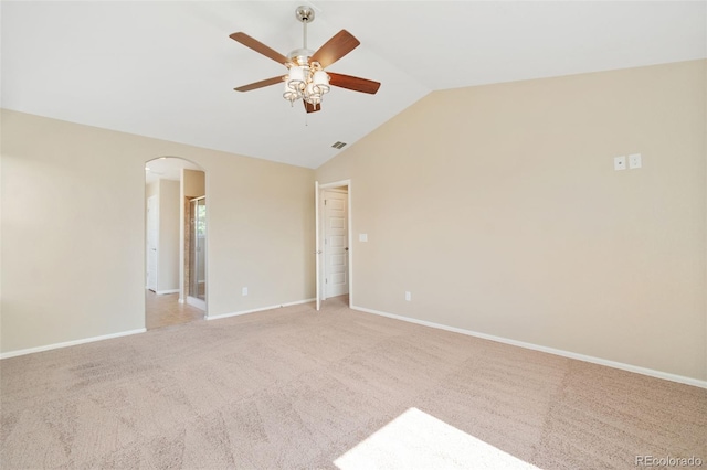 5894 Graphite St, Timnath, CO 80547 - spare room featuring arched walkways, lofted ceiling, a ceiling fan, and light carpet
