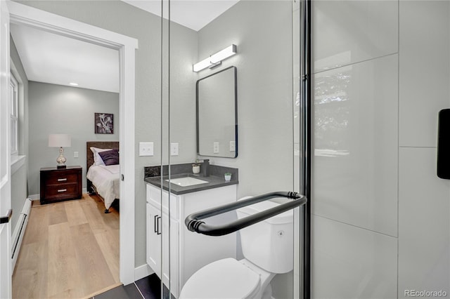 6842 Garland St, Arvada, CO 80004 - ensuite bathroom featuring wood finished floors and vanity