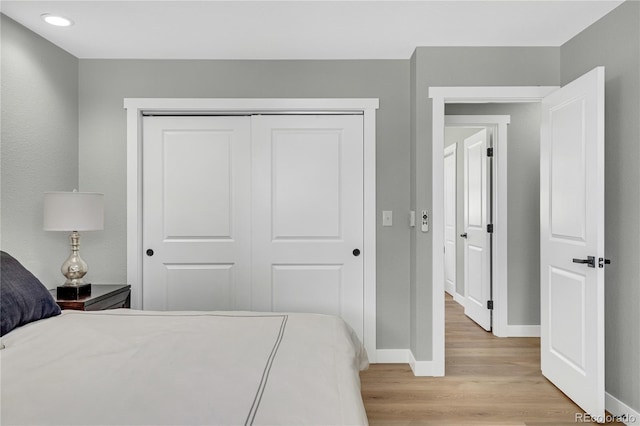 6842 Garland St, Arvada, CO 80004 - bedroom featuring light wood finished floors, a closet, and recessed lighting