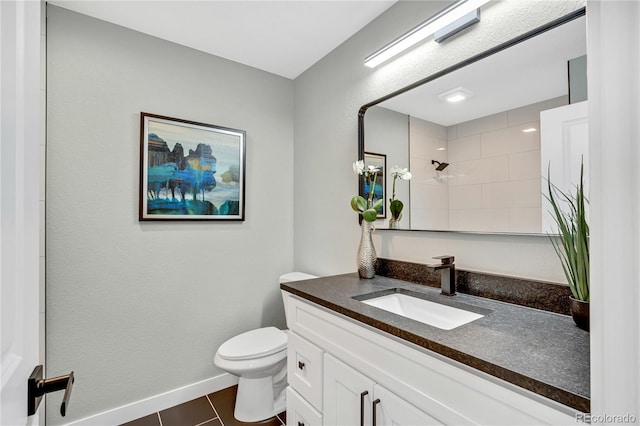 6842 Garland St, Arvada, CO 80004 - bathroom with vanity, tile patterned flooring, and a shower