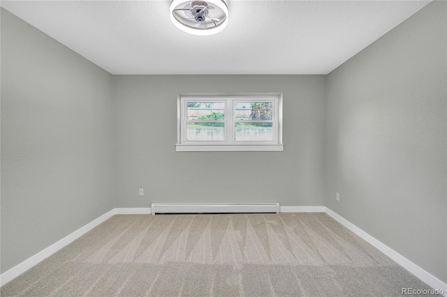 6842 Garland St, Arvada, CO 80004 - carpeted empty room featuring a baseboard radiator and baseboards