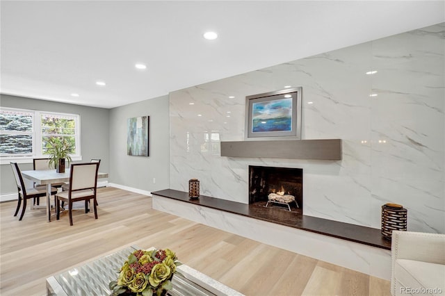 6842 Garland St, Arvada, CO 80004 - living area with recessed lighting, a premium fireplace, and wood finished floors