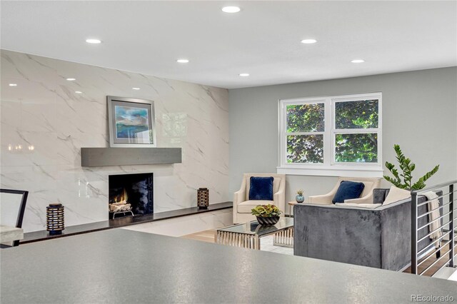 6842 Garland St, Arvada, CO 80004 - living room featuring recessed lighting and a fireplace