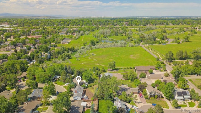 6842 Garland St, Arvada, CO 80004 - aerial perspective of suburban area featuring a nearby body of water
