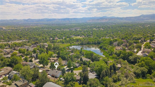 6842 Garland St, Arvada, CO 80004 - aerial perspective of suburban area featuring a water and mountain view